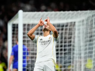 Real Madrid's Jude Bellingham celebrates after scoring his side's sixth goal during the Champions League opening phase soccer match between Real Madrid and Monaco in Madrid on Tuesday, Jan. 20, 2026. (AP Photo/Jose Breton)