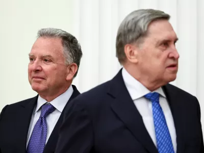 U.S. President Donald Trump's envoy Steve Witkoff, left, and Kremlin foreign policy adviser Yuri Ushakov, wait for their meeting with Russian President Vladimir Putin at the Senate Palace of the Kremlin, in Moscow, Thursday, Jan. 22, 2026. (Alexander Kazakov/Sputnik, Kremlin Pool Photo via AP)