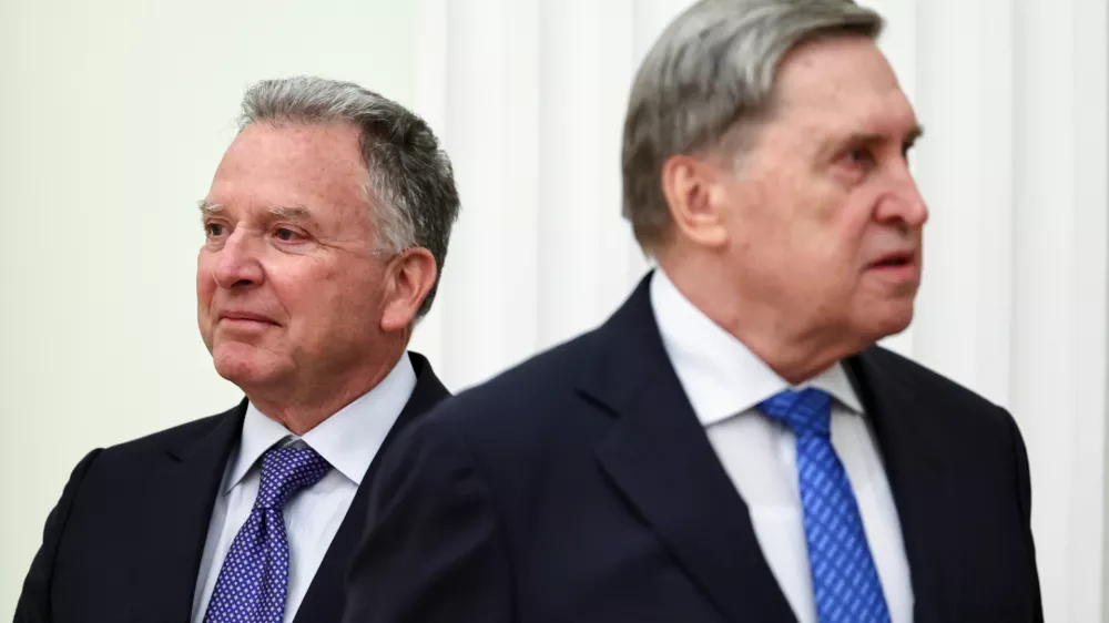 U.S. President Donald Trump's envoy Steve Witkoff, left, and Kremlin foreign policy adviser Yuri Ushakov, wait for their meeting with Russian President Vladimir Putin at the Senate Palace of the Kremlin, in Moscow, Thursday, Jan. 22, 2026. (Alexander Kazakov/Sputnik, Kremlin Pool Photo via AP)