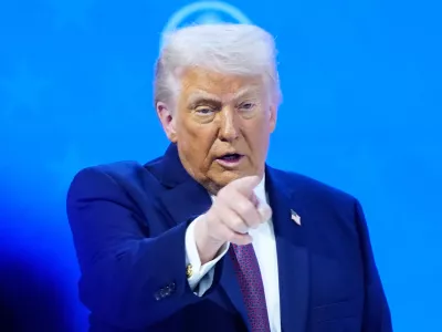 President Donald Trump reacts during a signing ceremony on his Board of Peace initiative at the Annual Meeting of the World Economic Forum in Davos, Switzerland, Thursday, Jan. 22, 2026. (AP Photo/Markus Schreiber)