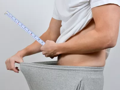 Well equipped. Man measure hes penis with a measuring tape.