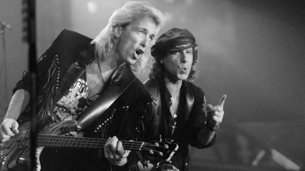 05 November 1991, Hesse, FrankfurtMain: Scorpions frontman Klaus Meine (R) and bassist Francis Buchholz take part in a performance by the German hard rock band Scorpions in Frankfurt am Main. The former bassist of the legendary German rock band Scorpions has died at the age of 71, his family said on Friday. Photo: Dieter Roosen/dpa