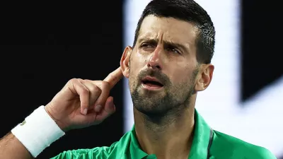 Tennis - Australian Open - Melbourne Park, Melbourne, Australia - January 24, 2026 Serbia's Novak Djokovic celebrates and gestures to crowd after winning his third round match against Netherlands' Botic van de Zandschulp REUTERS/Tingshu Wang   TPX IMAGES OF THE DAY