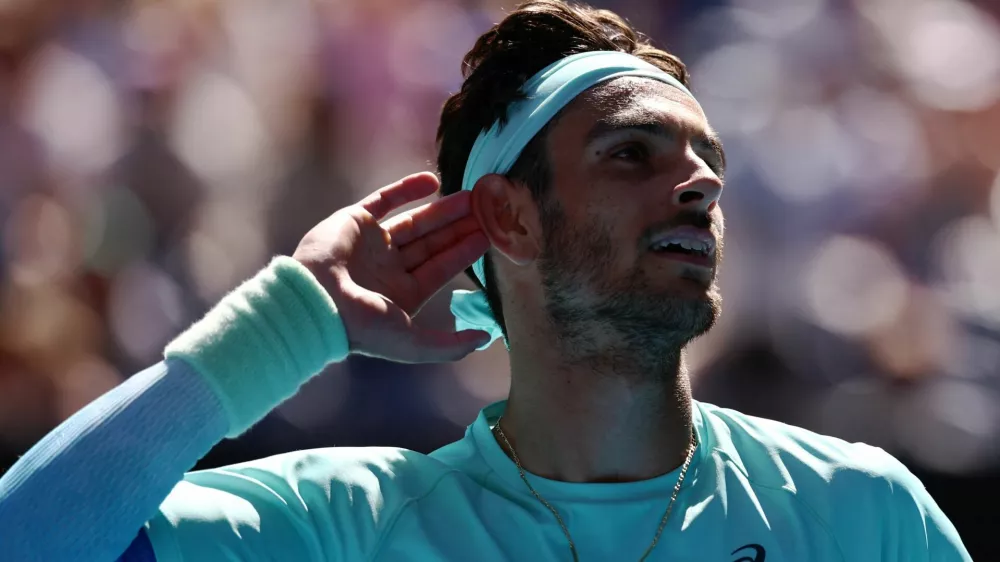 Tennis - Australian Open - Melbourne Park, Melbourne, Australia - January 26, 2026 Italy's Lorenzo Musetti reacts during his fourth round match against Taylor Fritz of the U.S. REUTERS/Tingshu Wang