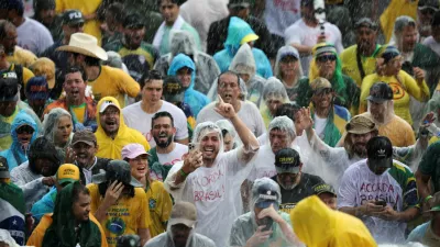 Supporters of former Brazilian President Jair Bolsonaro take part in a march entitled "Walk for Freedom and Justice," led by opposition congressman Nikolas Ferreira, as they arrive in Brasilia after a 240-km walk from Paracatu to protest in support of Bolsonaro, who is serving a 27-year sentence for plotting a coup, in Brasilia, Brazil, January 25, 2026. REUTERS/Mateus Bonomi   TPX IMAGES OF THE DAY