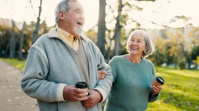 Senior couple, park and morning walk with conversation, love and bonding together with health. Wellness, marriage and retirement with outdoor, communication and coffee on urban garden path on date