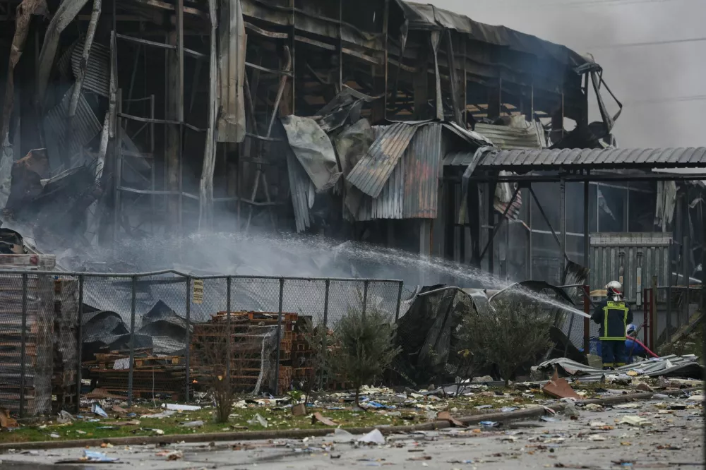Fireman works at the premises of a biscuit factory, following a fire which left victims and missing people, the fire brigade said, near Trikala, Greece, January 26, 2026. REUTERS/Thanos Floulis