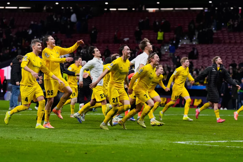 Bodo Glimt players celebrate at the end of the Champions League opening phase soccer match between Atletico Madrid and Bodo Glimt in Madrid, Spain, Wednesday, Jan. 28, 2026. (AP Photo/Manu Fernandez)