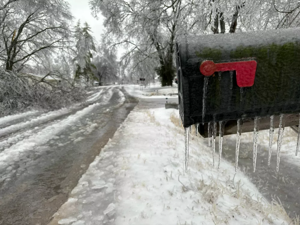Icicles form on a mailbox on a neighborhood street as a winter storm moves through Nashville, Tenn,, Sunday, Jan,. 25, 2026. (AP Photo/Holly Meyer)