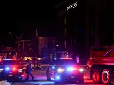 Police vehicles block a road near a hotel where Greg Bovino, who has been removed from his role as the "commander at large" for the U.S. Border Patrol, is reportedly staying, in Minneapolis, Minnesota, U.S., January 26, 2026. REUTERS/Shannon Stapleton