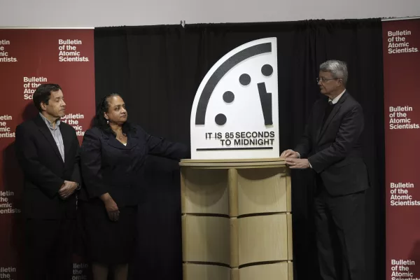 The Bulletin of the Atomic Scientists members, from left, Jon B. Wolfsthal, Asha M. George and Steve Fetter reveal the Doomsday Clock, set to 85 seconds to midnight, during a news conference at the Carnegie Endowment for International Peace, Friday, Jan. 23, 2026, in Washington. On Tuesday, they announced Earth is closer than it's ever been to destruction as Russia, China, the U.S. and other countries become "increasingly aggressive, adversarial and nationalistic." (AP Photo/Pablo Martinez Monsivais)
