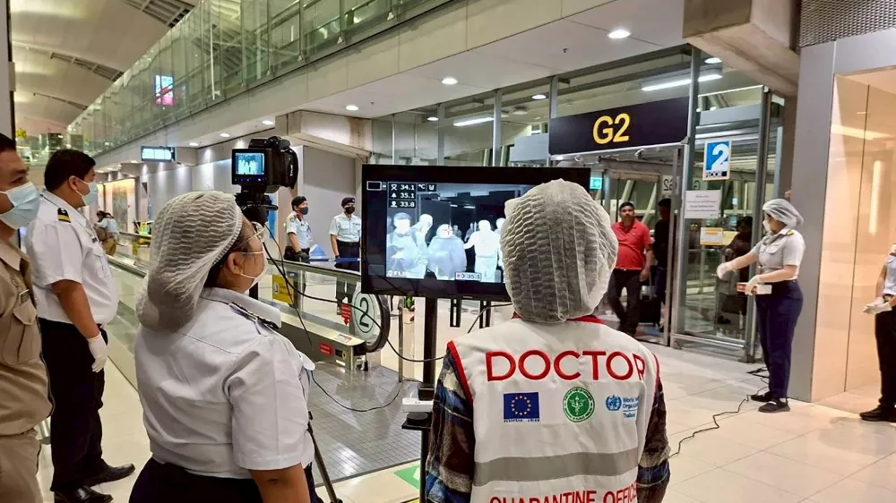 Airport health authorities wearing protective masks monitor passengers from international flights arriving at Suvarnabhumi International Airport in Bangkok, Thailand, January 25, 2026, following the implementation of health screening measures for passengers arriving from West Bengal, India, amid reports of a Nipah virus outbreak. Suvarnabhumi Airport Office /Handout via REUTERS  THIS IMAGE HAS BEEN SUPPLIED BY A THIRD PARTY.NO RESALES. NO ARCHIVES