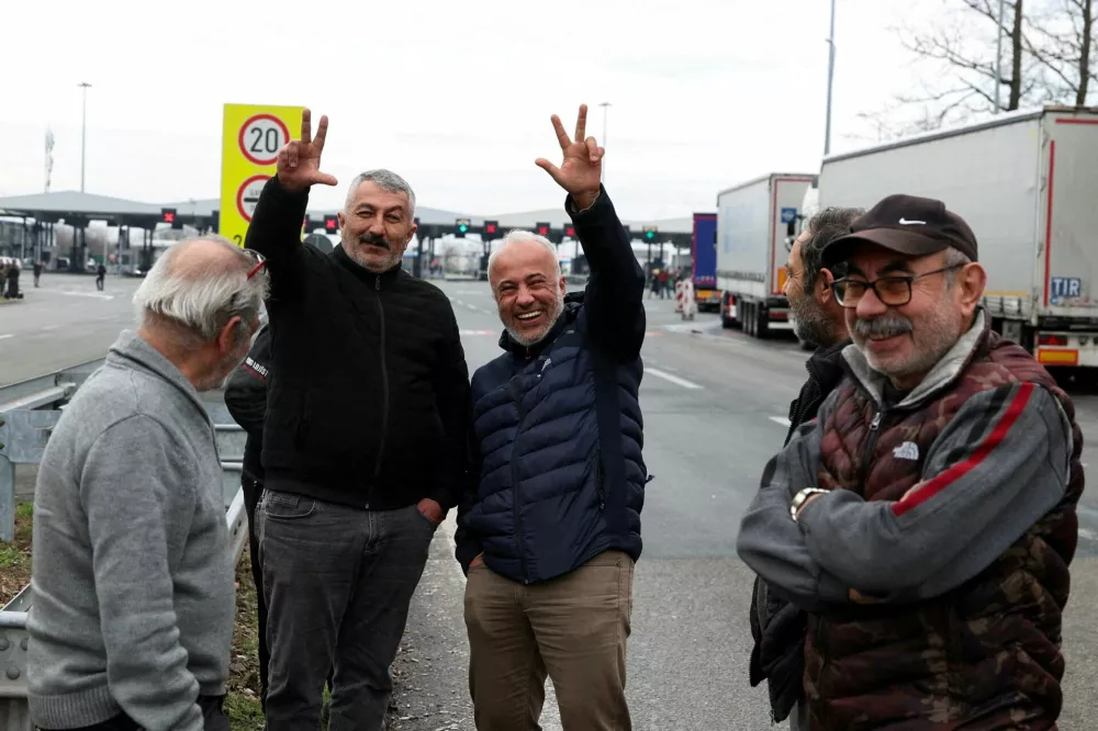 FILE PHOTO: Truck drivers react during a protest by truck drivers and transport union representatives at the Serbia-Croatia border crossings, citing disruptions linked to the European Union's new Entry-Exit System (EES), in Batrovci, Serbia, January 26, 2026. REUTERS/Zorana Jevtic/File Photo