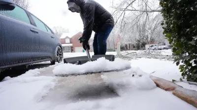 Ice and snow are shoveled during a winter storm Sunday, Jan. 25, 2026, in Nashville, Tenn. (AP Photo/George Walker IV, File)