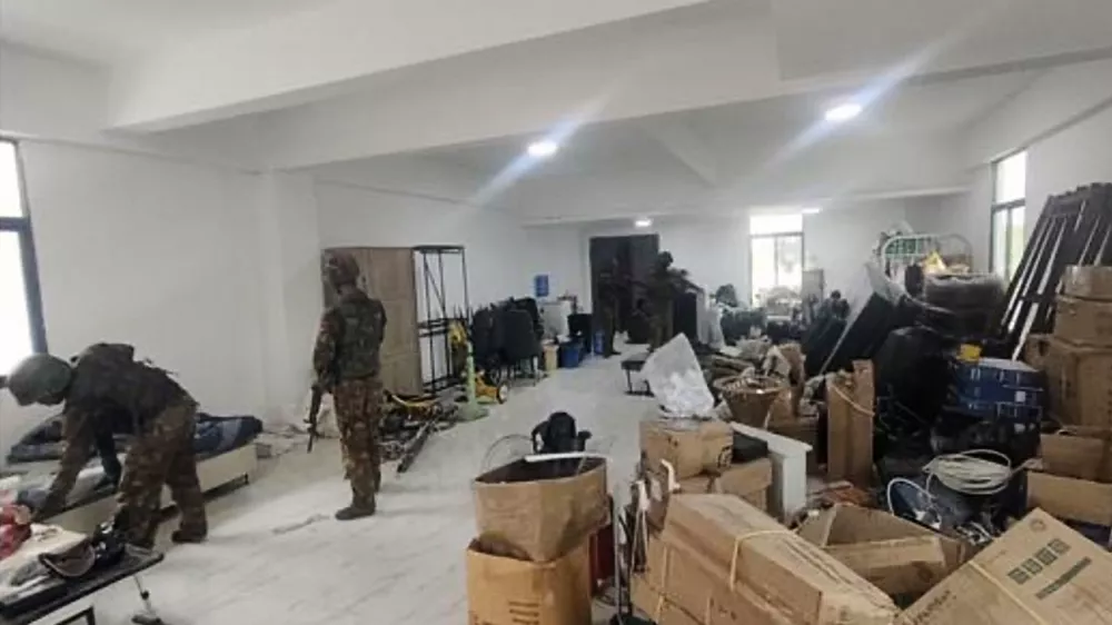 In this image provided by the Myanmar military on Oct. 19, 2025, soldiers raid the KK Park online scam center in Myawaddy township, Karen State, Myanmar. (The Myanmar Military True News Information Team via AP)