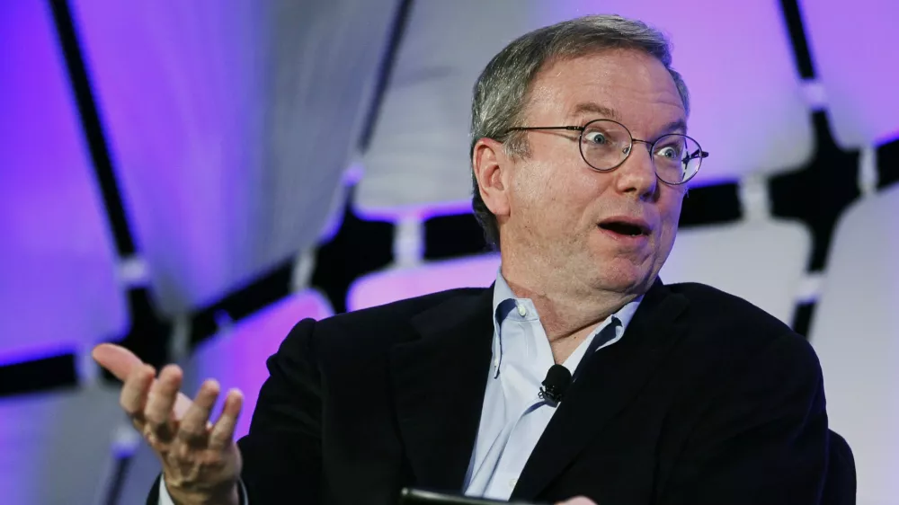 Google Executive Chairman Eric Schmidt, holding a cell phone running Google software speaks on a panel discussing "The Next Big Thing" on the opening day of the Consumer Electronics Show in Las Vegas January 10, 2012.  REUTERS/Rick Wilking (UNITED STATES - Tags: BUSINESS SCIENCE TECHNOLOGY)