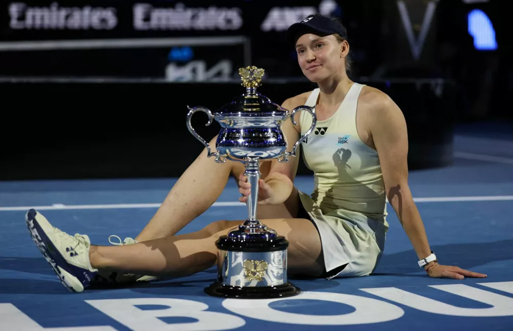 Tennis - Australian Open - Melbourne Park, Melbourne, Australia - January 31, 2026 Kazakhstan's Elena Rybakina poses with the trophy after winning her women's singles final against Belarus' Aryna Sabalenka REUTERS/Hollie Adams