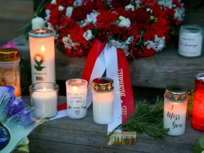FILE PHOTO: Candles burn at a makeshift memorial outside the "Le Constellation bar" almost a month after a deadly fire during a New Year's Eve party, in the upscale ski resort of Crans-Montana, Switzerland, January 31, 2026. REUTERS/Denis Balibouse/File Photo