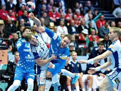 Croatia's Luca Cindric, center, throws the ball during the Euro 2026 third place match between Iceland and Croatia in Herning, Denmark, Sunday, Feb. 1, 2026. (Henning Bagger/Ritzau Scanpix via AP)