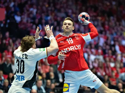 Denmark's Mathias Gidsel, right, throws the ball during the Euro 2026 final match between Denmark and Germany in Herning, Denmark, Sunday, Feb. 1, 2026. (Thomas Traasdahl/Ritzau Scanpix via AP)