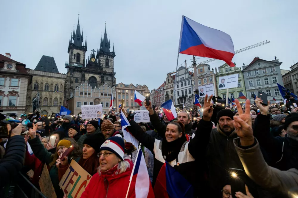 People take part in a rally in support of Czech President Petr Pavel, organised by Million Moments for Democracy group in reaction to dispute between President Pavel and Czech Foreign Minister and Motorists chair Petr Macinka, in Prague, Czech Republic, February 1, 2026. REUTERS/Eva Korinkova