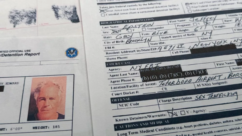 A document that was included in the U.S. Department of Justice release of the Jeffrey Epstein files is photographed Sunday, Feb. 1, 2026, shows the report when Epstein was taken into custody on July 6, 2019. (AP Photo/Jon Elswick)