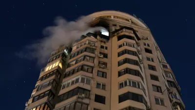 Smoke billows from an apartment building after it was struck by a drone during Russian missile and drone attacks, in Kyiv, Ukraine, February 3, 2026. REUTERS/Thomas Peter