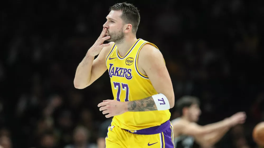 Feb 3, 2026; Brooklyn, New York, USA; Los Angeles Lakers guard Luka Doncic (77) gestures after scoring in the first quarter against the Brooklyn Nets at Barclays Center. Mandatory Credit: Wendell Cruz-Imagn Images