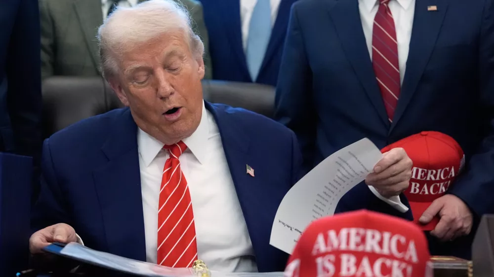 President Donald Trump speaks in the Oval Office of the White House, Tuesday, Feb. 3, 2026, in Washington, before signing a spending bill that will end a partial shutdown of the federal government. (AP Photo/Alex Brandon)