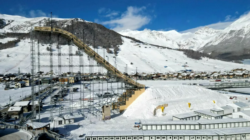 FILE PHOTO: A drone view shows the big ski jump in the snow park in Livigno, which will host all Snowboard and Freestyle Skiing events, including disciplines like Halfpipe, Slopestyle, Big Air, Ski Cross, Snowboard Cross, Moguls, Aerials, and Parallel Giant Slalom as part of the Milano Cortina Winter Olympic games in Italy, January 9, 2026. REUTERS/Yara Nardi/File Photo