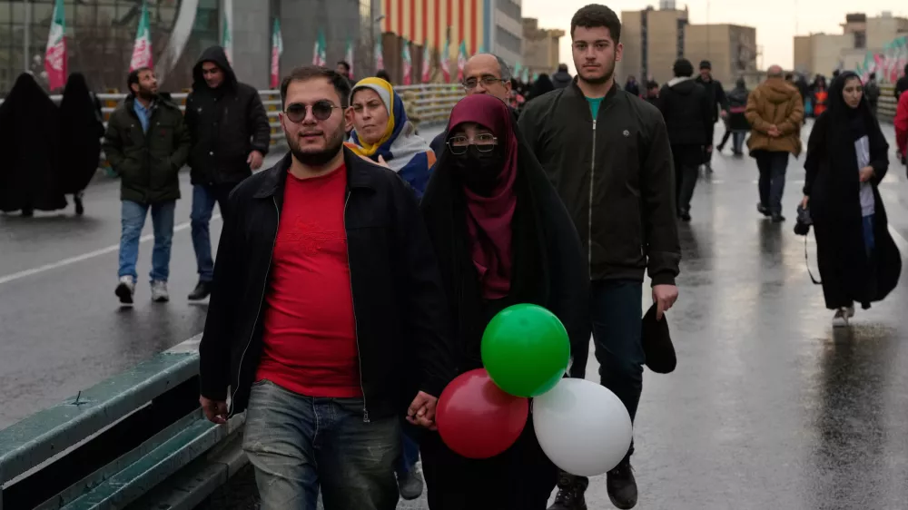 People attend a state-organised rally in Tehran, Iran, Wednesday, Feb. 4, 2026, celebrating the birthday of Imam Mahdi, or "Hidden Imam," a 9th-century saint whom Shiite Muslims believe will return at the end of time as a universal reformer to end tyranny and promote justice. (AP Photo/Vahid Salemi)
