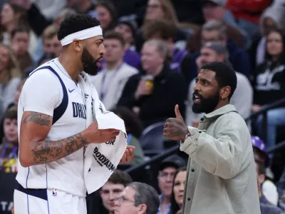 Jan 8, 2026; Salt Lake City, Utah, USA; Dallas Mavericks forward Anthony Davis (l3) and guard Kyrie Irving (right) speak during a second half break in action against the Utah Jazz at Delta Center. Mandatory Credit: Rob Gray-Imagn Images