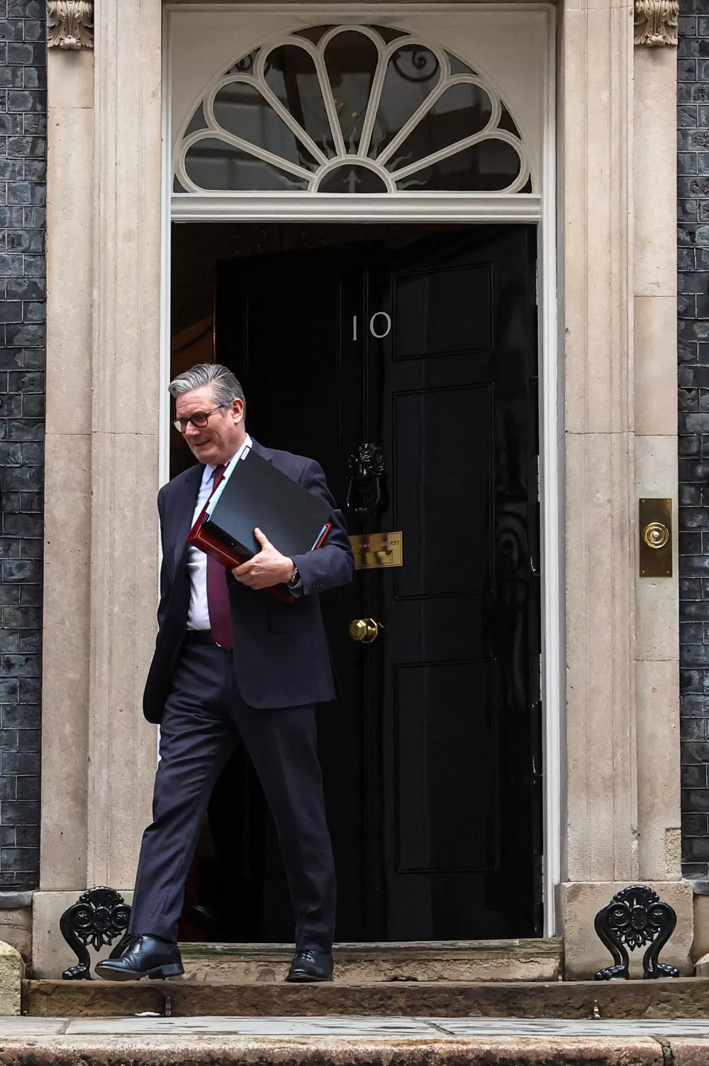 British Prime Minister Keir Starmer leaves 10 Downing Street for Prime Minister's Questions in London, Britain, February 4, 2026. REUTERS/Toby Melville