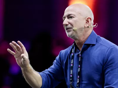 Amazon founder Jeff Bezos gestures as he speaks at the main panel of Italian Tech Week 2025 in Turin, Italy October 3, 2025. REUTERS/Remo Casilli