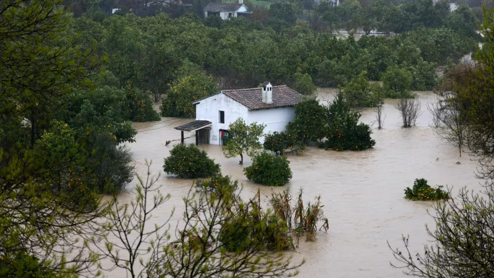 A flooded house near the river Guadalete as storm Leonardo hits parts of Spain, in Jimera de Libar, Spain, February 4, 2026. REUTERS/Jon Nazca