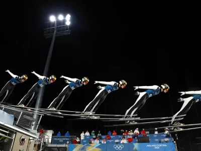 Milano Cortina 2026 Olympics - Ski Jumping - Men's Large Hill - Official Training - Predazzo Ski Jumping Stadium, Predazzo, Italy - February 12, 2026. Domen Prevc of Slovenia in action during training. This is an in-camera multiple exposure picture. REUTERS/Kai Pfaffenbach