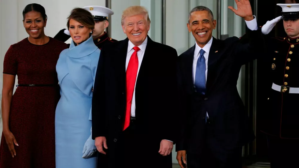 FILE PHOTO: U.S. President Barack Obama (R) and first lady Michelle Obama (L) greet U.S. President-elect Donald Trump and his wife Melania for tea before the inauguration at the White House in Washington, U.S. January 20, 2017. REUTERS/Jonathan Ernst/File Photo