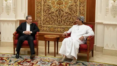 Iran's Foreign Minister Abbas Araqchi is welcomed by an Omani official upon his arrival in Muscat, Oman, in this handout image obtained on February 6, 2026. Iranian Foreign Ministry/WANA (West Asia News Agency)/Handout via REUTERS ATTENTION EDITORS - THIS PICTURE WAS PROVIDED BY A THIRD PARTY