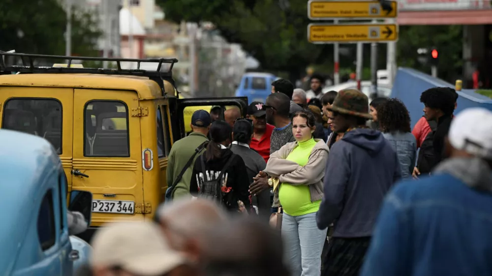 People wait for transportation as Cubans brace for fuel scarcity measures after U.S. tightened oil supply blockade, Havana, Cuba, February 6, 2026. REUTERS/Norlys Perez