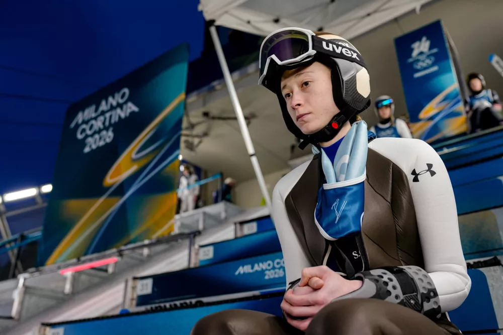 Nika Prevc, of Slovenia, waits her turn to jump during a ski jumping, women's normal hill, training session, at the 2026 Winter Olympics, in Predazzo, Italy, Thursday, Feb. 5, 2026. (AP Photo/Matthias Schrader)