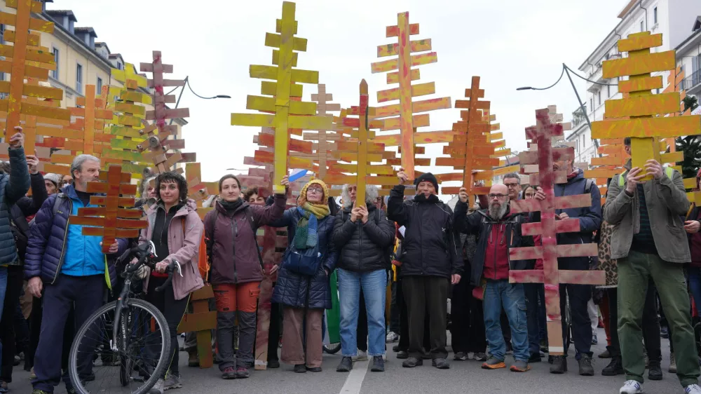 Demonstrators marched against the environmental impact of the Milan Cortina Winter Olympics and the presence of U.S. Immigration and Customs Enforcement agents, in Milan, Saturday Feb. 7, 2026. (Claudio Furlan/LaPresse via AP)