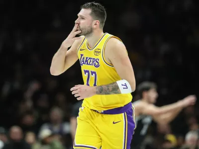 Feb 3, 2026; Brooklyn, New York, USA; Los Angeles Lakers guard Luka Doncic (77) gestures after scoring in the first quarter against the Brooklyn Nets at Barclays Center. Mandatory Credit: Wendell Cruz-Imagn Images