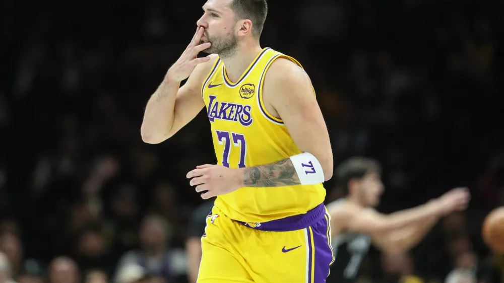 Feb 3, 2026; Brooklyn, New York, USA; Los Angeles Lakers guard Luka Doncic (77) gestures after scoring in the first quarter against the Brooklyn Nets at Barclays Center. Mandatory Credit: Wendell Cruz-Imagn Images