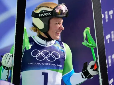 Slovenia's Ilka Stuhec at the finish area during an alpine ski, women's downhill official training, at the 2026 Winter Olympics, in Cortina d'Ampezzo, Italy, Friday, Feb. 6, 2026. (AP Photo/Giovanni Auletta)