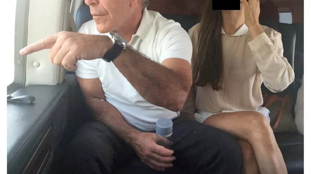 Late financier and convicted sex offender Jeffrey Epstein appears with a woman, whose identity has been obscured, in this image from the Epstein estate released by House Oversight Committee Democrats in Washington, D.C., U.S., on December 18, 2025. House Oversight Committee Democrats/Handout via REUTERS THIS IMAGE HAS BEEN SUPPLIED BY A THIRD PARTY. REDACTED AREA FROM SOURCE.   TPX IMAGES OF THE DAY