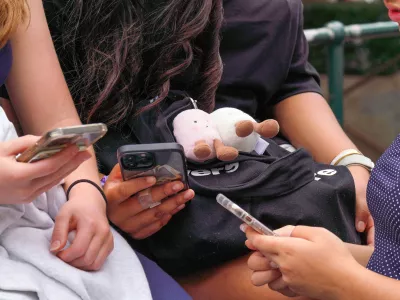 SYDNEY, AUSTRALIA - DECEMBER 10: Children use their phones, as Australia's new legislation restricting social media access for those under 16 comes into force in Sydney, Australia, on December 10, 2025. The rollout of the policy has prompted national debate over youth safety and digital regulation. Claudio Galdames Alarcon / AnadoluNo Use USA No use UK No use Canada No use France No use Japan No use Italy No use Australia No use Spain No use Belgium No use Korea No use South Africa No use Hong Kong No use New Zealand No use Turkey
