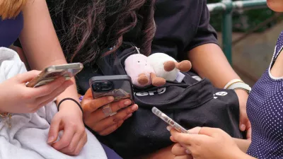 SYDNEY, AUSTRALIA - DECEMBER 10: Children use their phones, as Australia's new legislation restricting social media access for those under 16 comes into force in Sydney, Australia, on December 10, 2025. The rollout of the policy has prompted national debate over youth safety and digital regulation. Claudio Galdames Alarcon / AnadoluNo Use USA No use UK No use Canada No use France No use Japan No use Italy No use Australia No use Spain No use Belgium No use Korea No use South Africa No use Hong Kong No use New Zealand No use Turkey