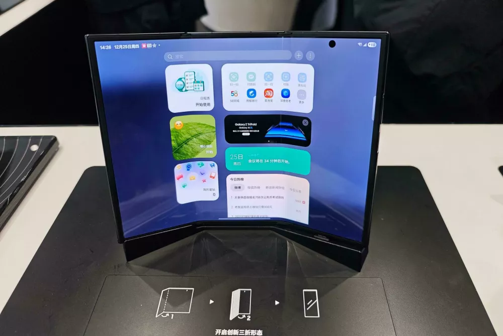Customers experience the Galaxy Z TriFold smartphone at a flagship store in Shanghai, China, 25 December, 2025.No Use China. No Use France.