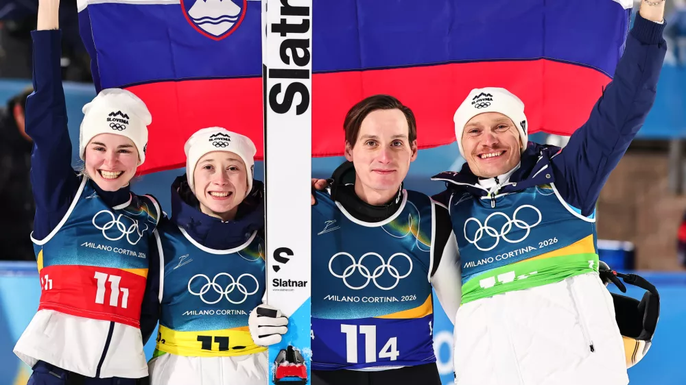 10 February 2026, Italy, Predazzo: (L-R) Slovenia's Nika Vodan, Nika Prevc, Domen Prevc and Anze Lanisek celebrate after the Ski Jumping Mixed team competition of the 2026 Winter Olympic Games at Milan-Cortina. Photo: Daniel Karmann/dpa