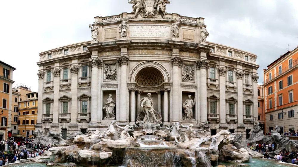 "Rome, Italy - June 2, 2010: Tourist in Rome are visiting and wishing in Fontana Di Trevi, a famous place in Rome."